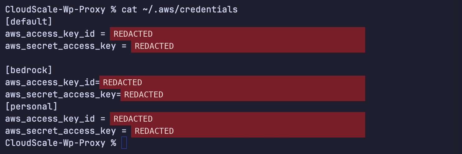 A terminal running cat ~/.aws/credentials, printing three AWS access keys and secrets for the default, bedrock and personal profiles, redacted for this picture.